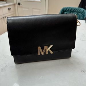 Michael Kors Purse. Black with gold accent. Used once. Perfect condition